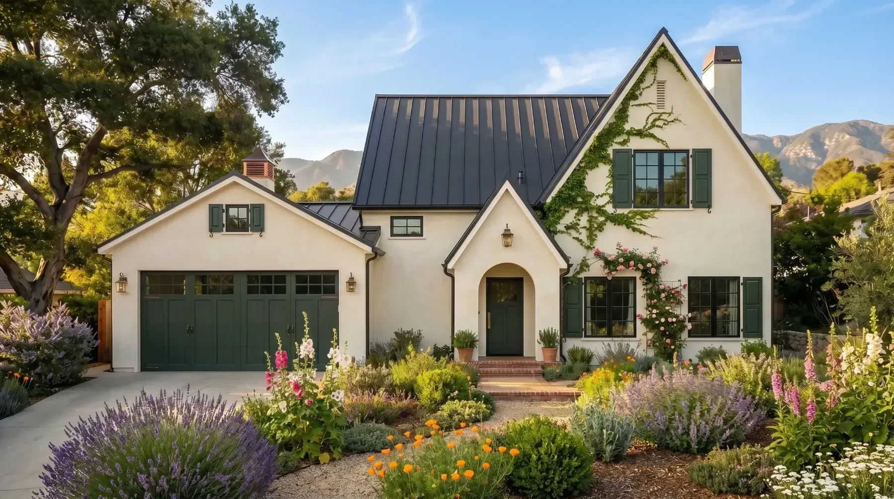 Parkman, an English cottage exterior with a dark metal roof and a garden of lavender